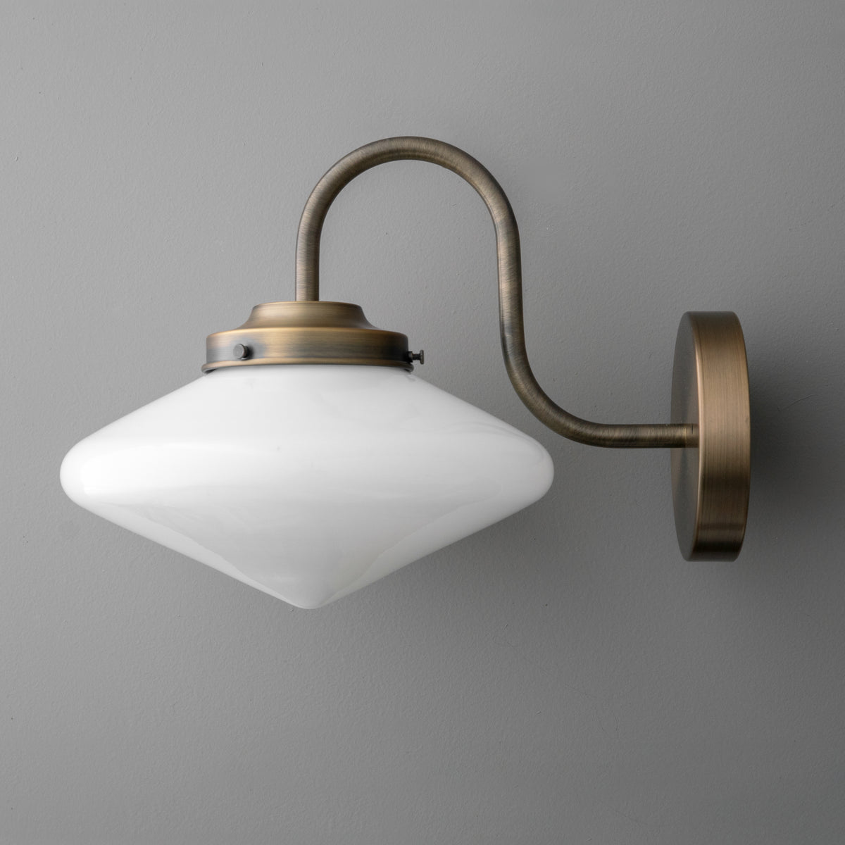 Vintage brass wall sconce with frosted white glass diamond-shaped shade and curved arm. - SCONCE MODEL NO. 1021