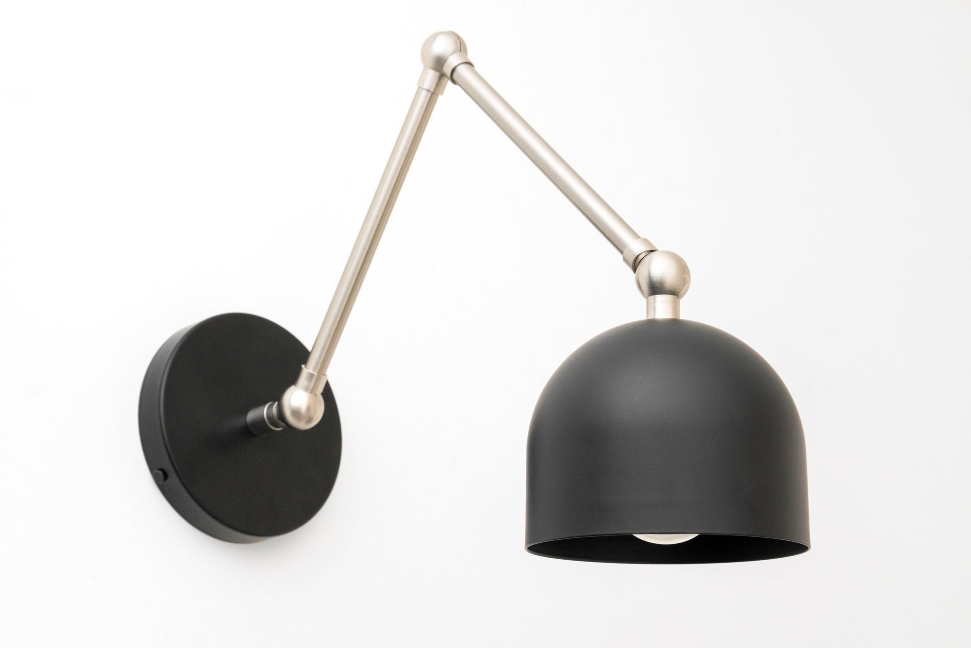 Matte black dome-shaped metal shade with adjustable brushed nickel arm wall sconce. - SCONCE MODEL NO. 5998