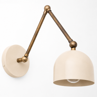 Adjustable industrial wall sconce with matte beige dome shade and aged brass arm. - SCONCE MODEL NO. 5998