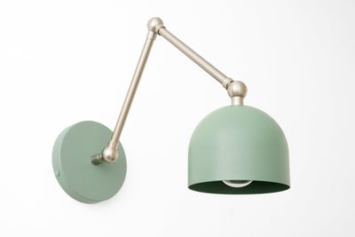Adjustable industrial wall sconce with matte green dome shade and brushed metal arm. - SCONCE MODEL NO. 5998