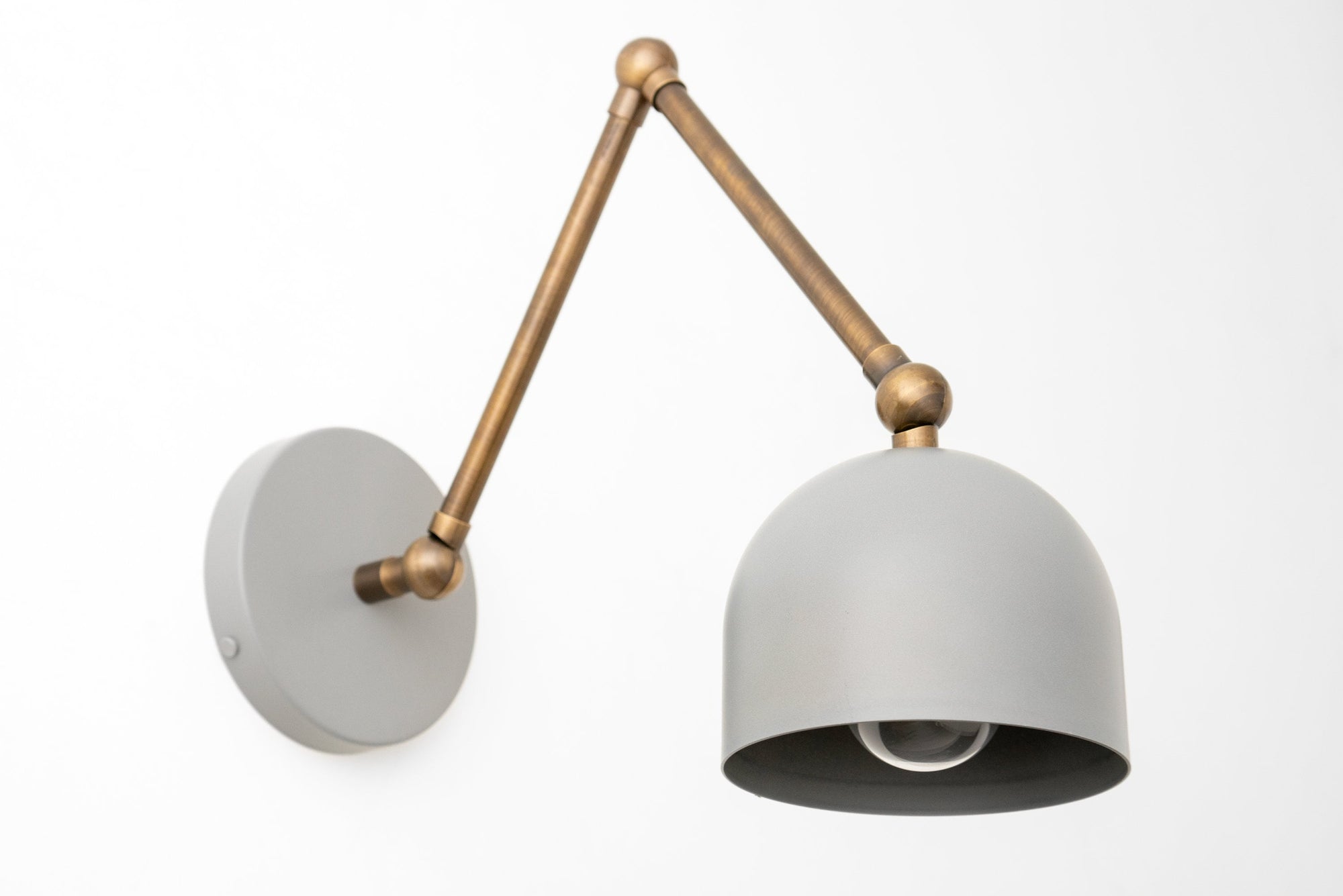 Adjustable industrial wall sconce with matte gray dome shade and gold-toned articulated arm. - SCONCE MODEL NO. 5998