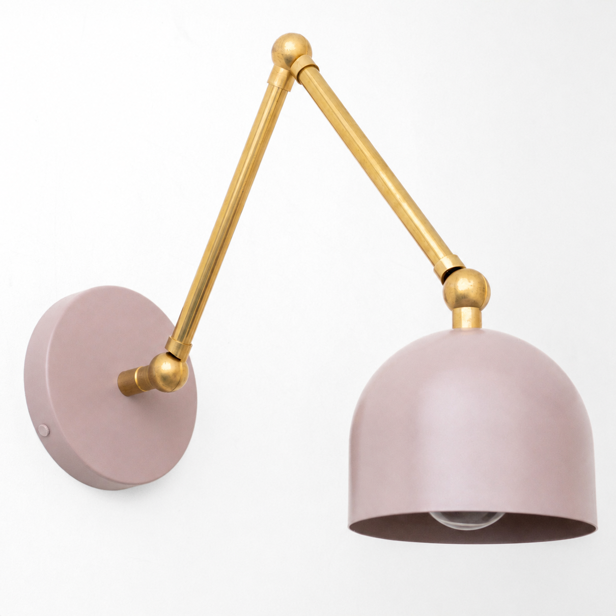 Adjustable industrial-style wall sconce with matte pink dome shade and brass arm. - SCONCE MODEL NO. 5998