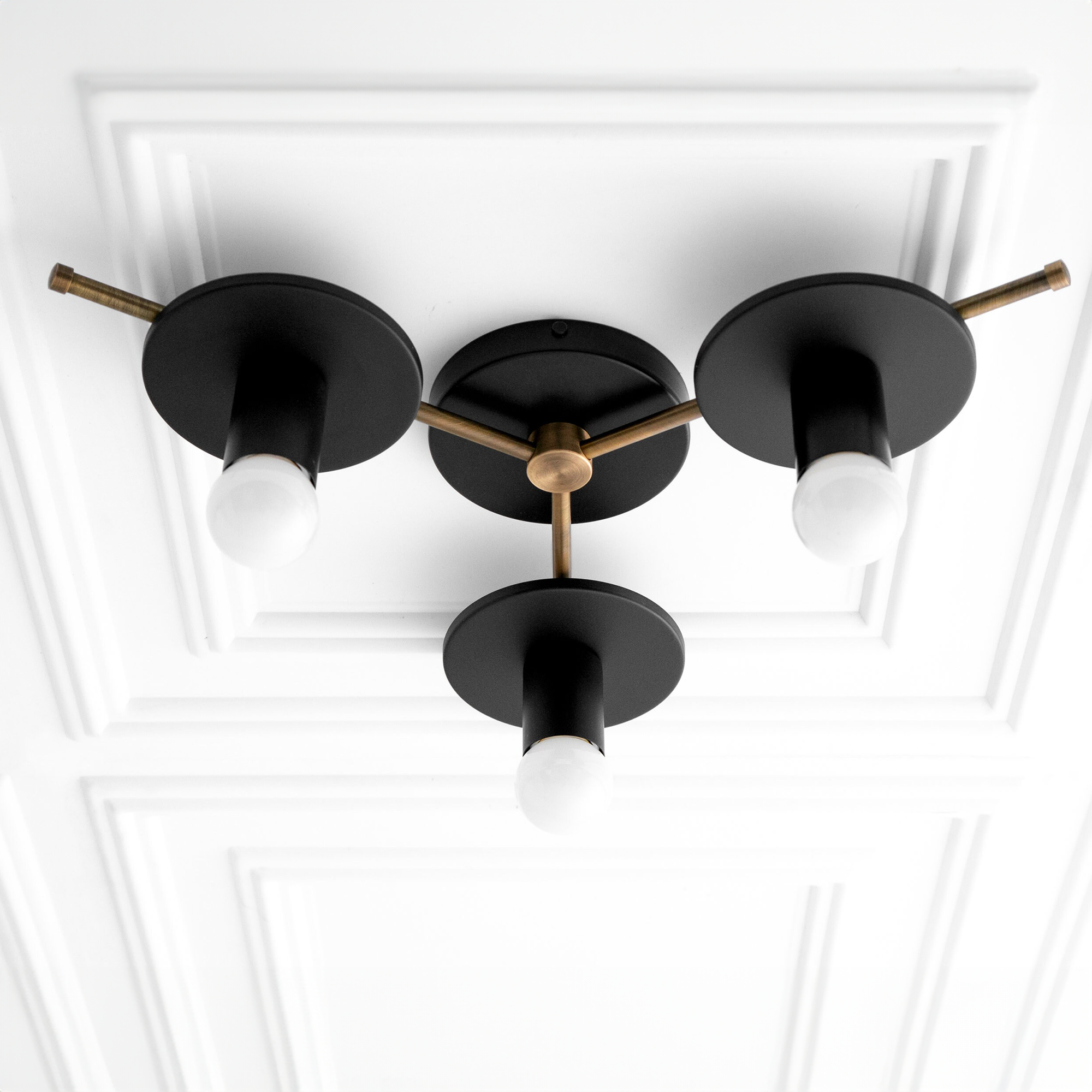 Three-light flush mount chandelier with matte black shades and antique brass accents. - CHANDELIER MODEL NO. 9526