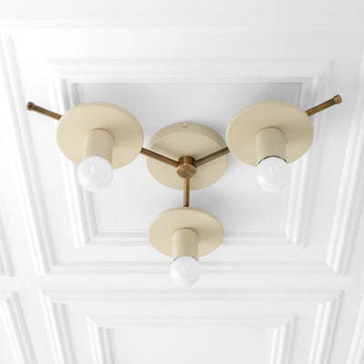 Mid-century modern flush mount ceiling light with three beige circular shades and exposed white bulbs on brass rods. - CHANDELIER MODEL NO. 9526