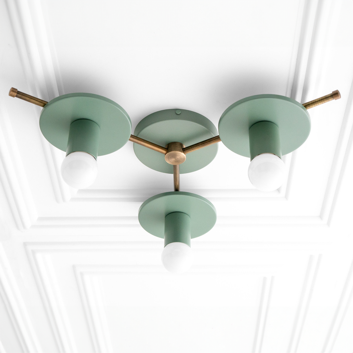 Mid-century modern chandelier with three green flush mount shades and raw brass arms and fixtures. - CHANDELIER MODEL NO. 9526