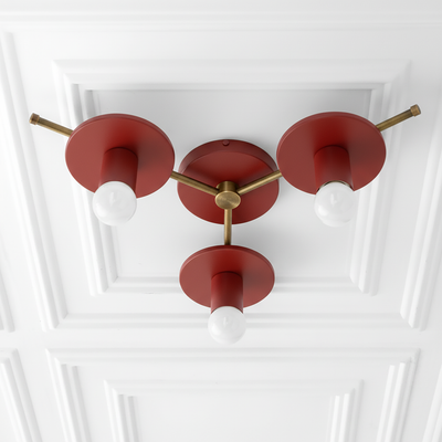 Mid-century modern flush mount ceiling light with three exposed white bulbs and matte red metal shades on brass arms. - CHANDELIER MODEL NO. 9526