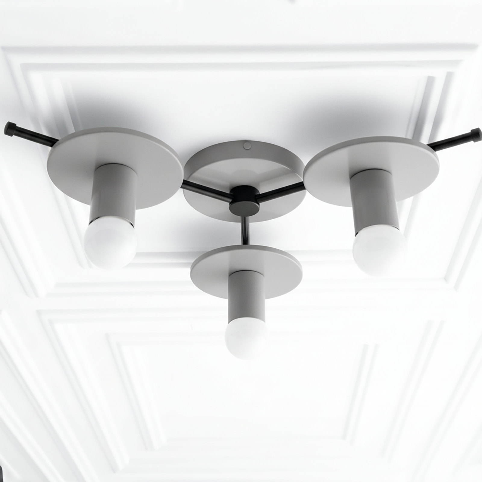 Flush mount chandelier with three matte gray cylindrical shades and matte black metal accents on white ceiling panel. - CHANDELIER MODEL NO. 9526