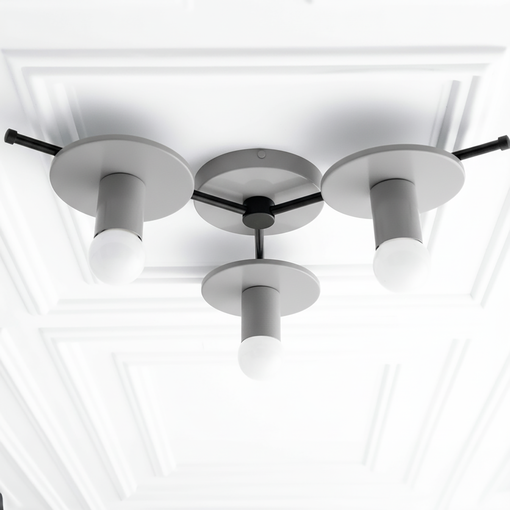 Mid-century modern flush mount ceiling light with three white bare bulbs and matte black fixtures. - CHANDELIER MODEL NO. 9526