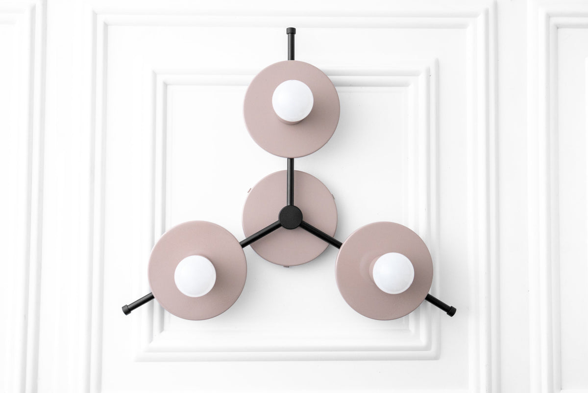 Mid-century modern chandelier with three matte pink circular shades and exposed white bulbs on black metal arms. - CHANDELIER MODEL NO. 9526