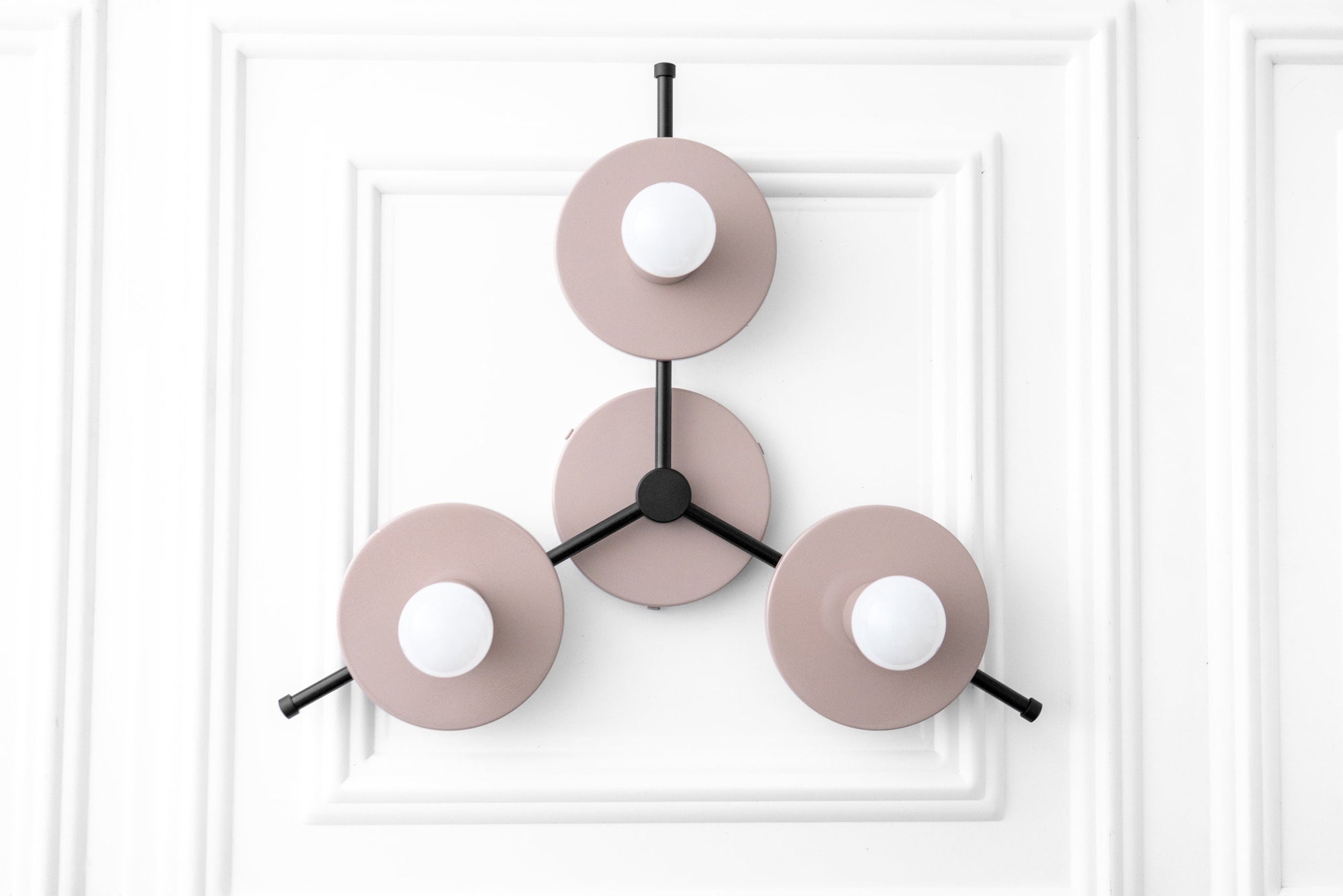 Mid-century modern chandelier with three matte pink circular shades and exposed white bulbs on black metal arms. - CHANDELIER MODEL NO. 9526