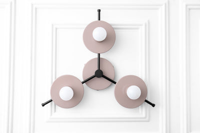 Mid-century modern chandelier with three matte pink circular shades and exposed white bulbs on black metal arms. - CHANDELIER MODEL NO. 9526