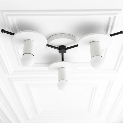 Mid-century modern flush mount chandelier with three white cylindrical shades and black fixtures on a white ceiling panel. - CHANDELIER MODEL NO. 9526