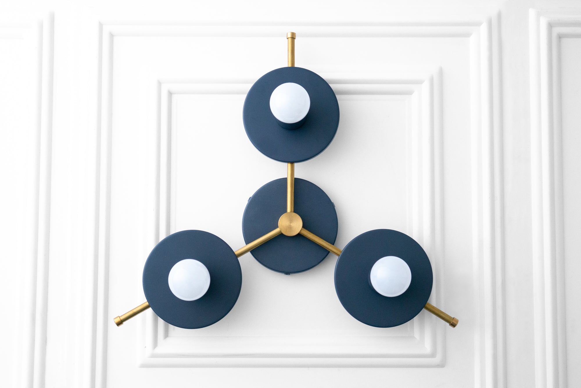 Mid-century modern chandelier with three navy blue circular shades and exposed white bulbs on gold metal arms. - CHANDELIER MODEL NO. 9526