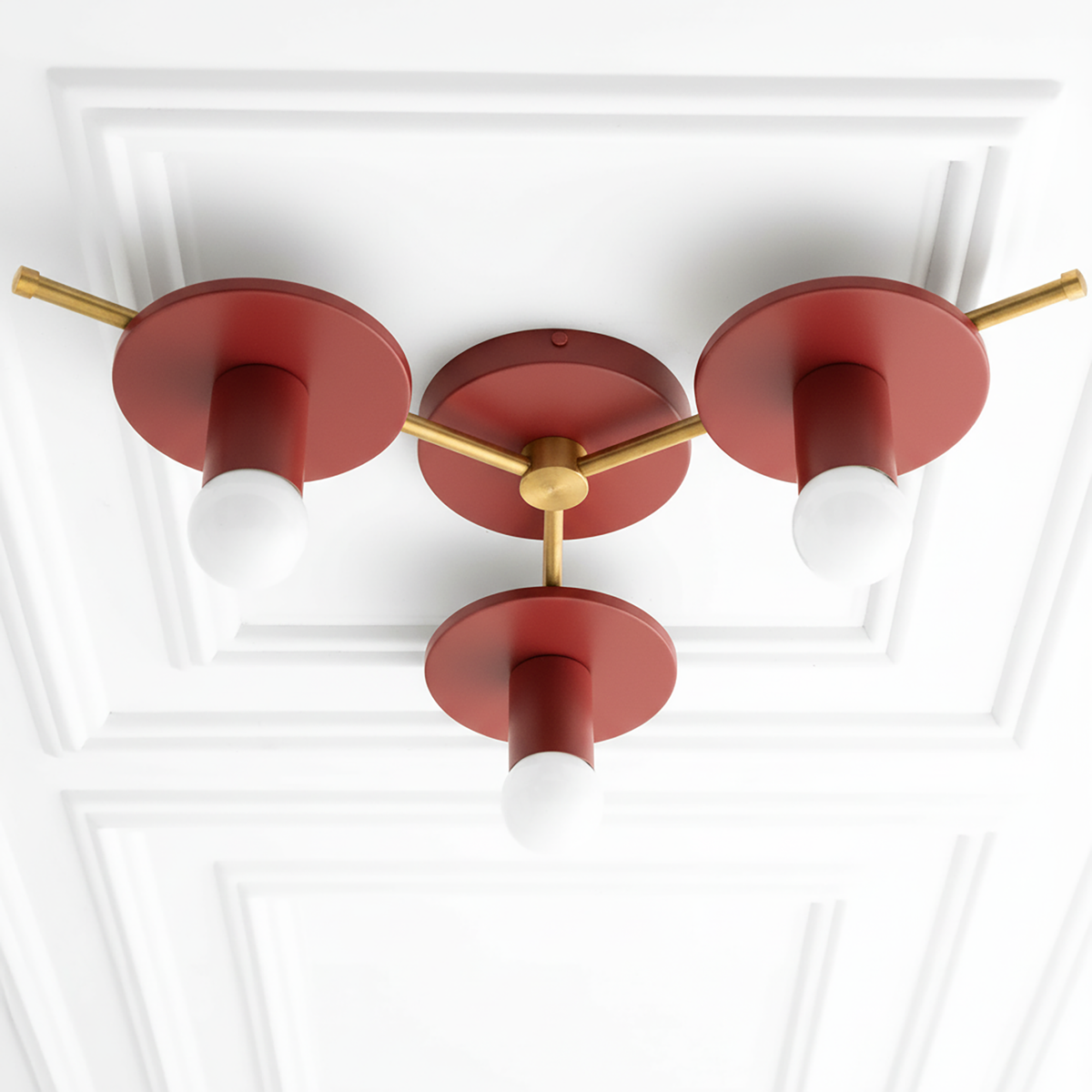Mid-century modern flush mount ceiling light with three exposed bulbs, red circular shades, and gold metal accents. - CHANDELIER MODEL NO. 9526