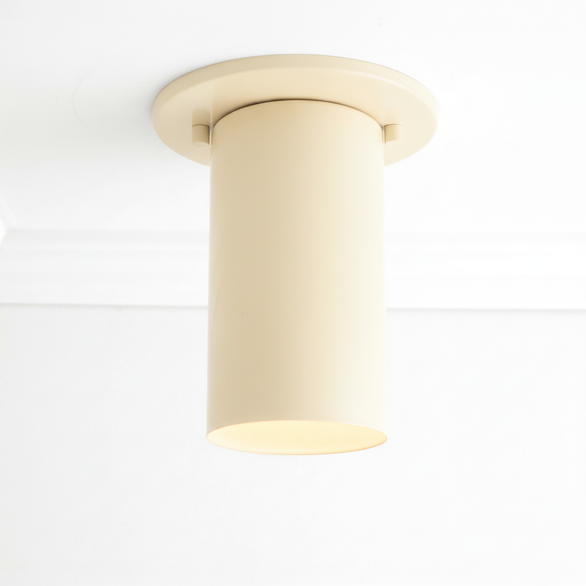 Cream cylindrical flush mount ceiling light with smooth matte finish and round base plate. - CEILING LIGHT MODEL NO. 4771