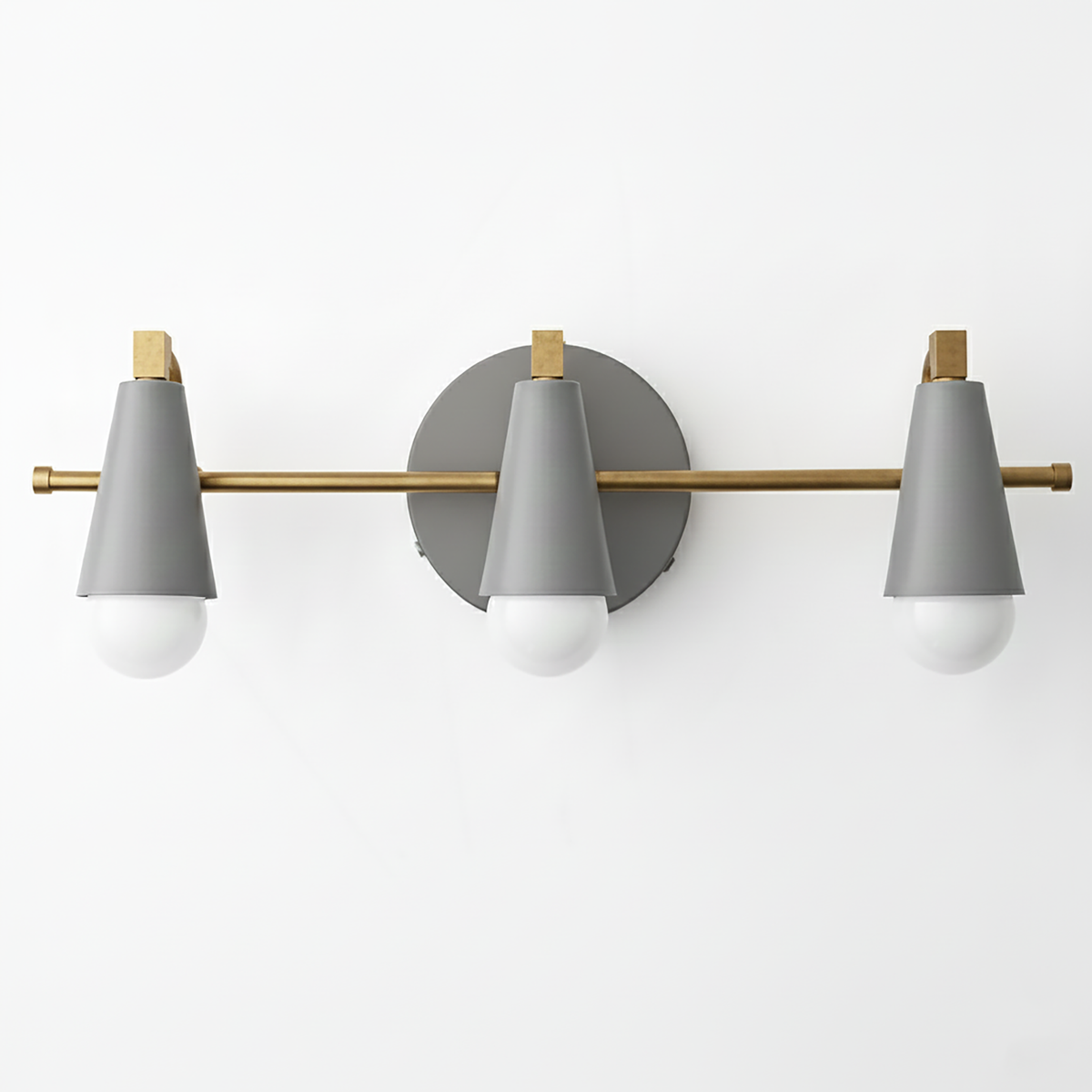 Three-light vanity fixture with matte gray conical shades, brass horizontal bar, and round gray wall mount. - VANITY LIGHT MODEL NO. 8084