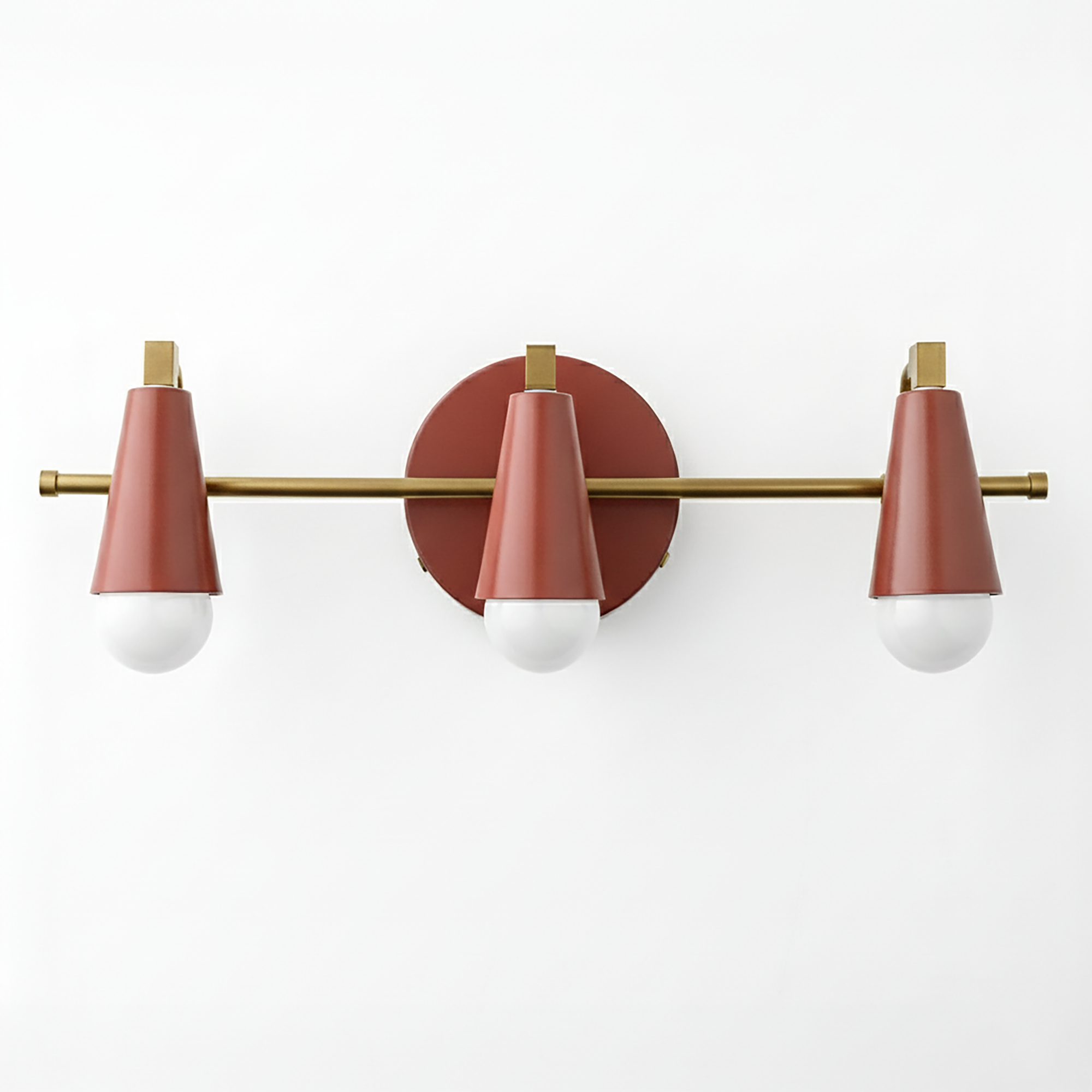 Mid-century modern 3-bulb vanity light with matte rose gold cone shades and brass accents. - VANITY LIGHT MODEL NO. 8084