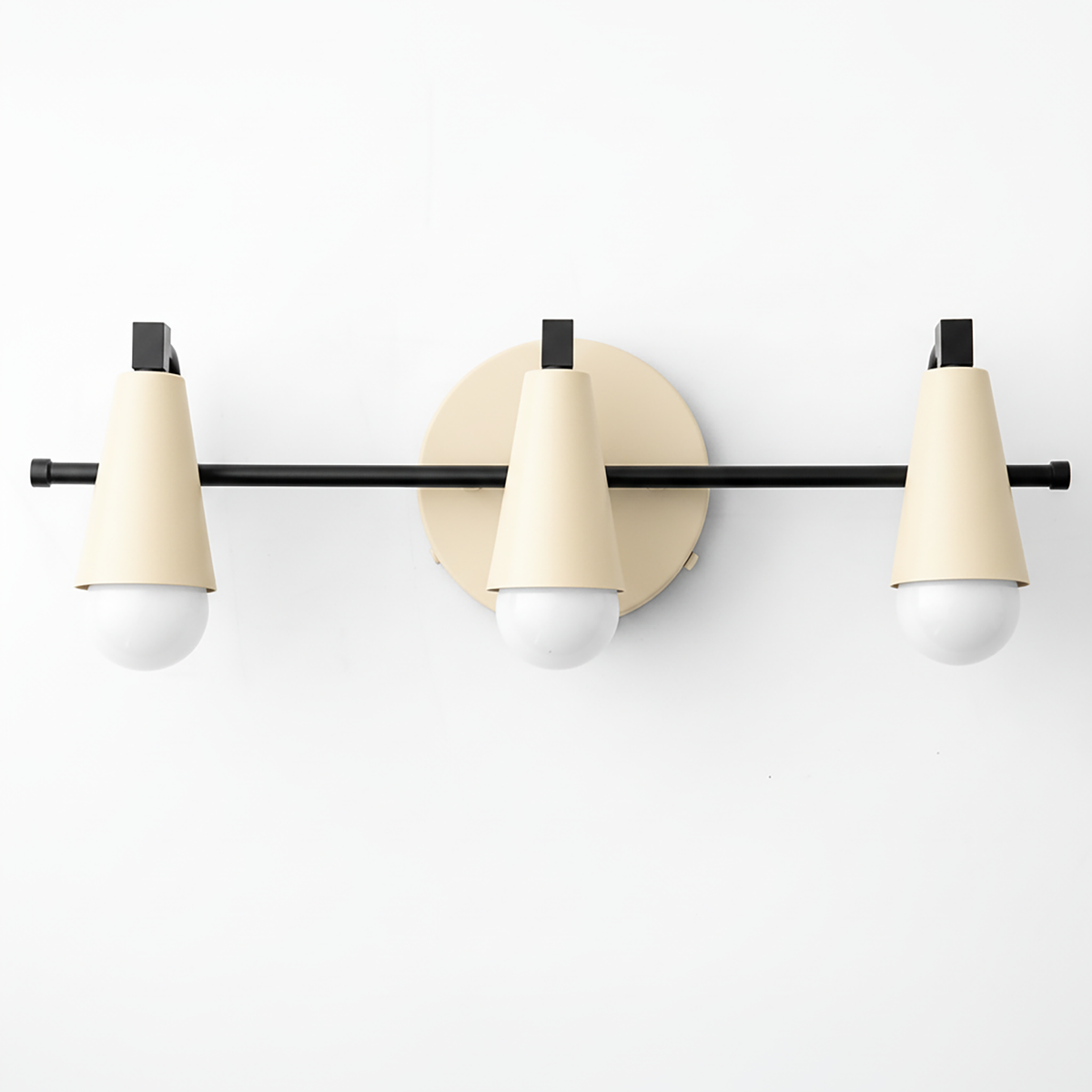 Three-light vanity fixture with matte cream conical shades and black metal accents on a circular wall mount. - VANITY LIGHT MODEL NO. 8084