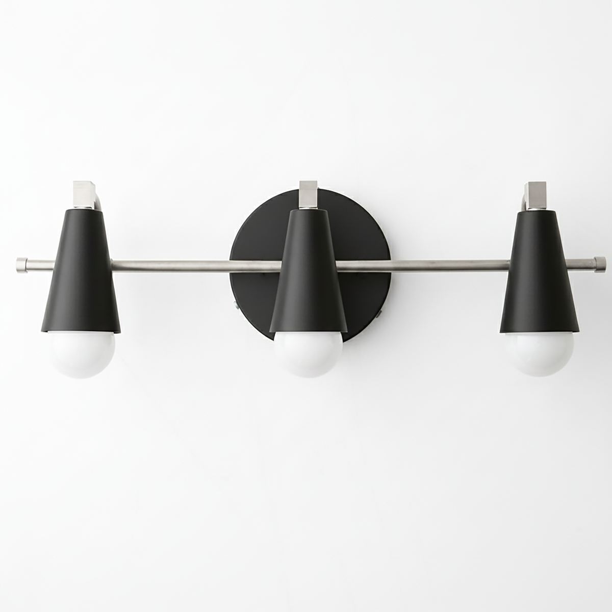 Three-bulb vanity light with matte black conical shades and brushed nickel horizontal rod and round wall mount. - VANITY LIGHT MODEL NO. 8084