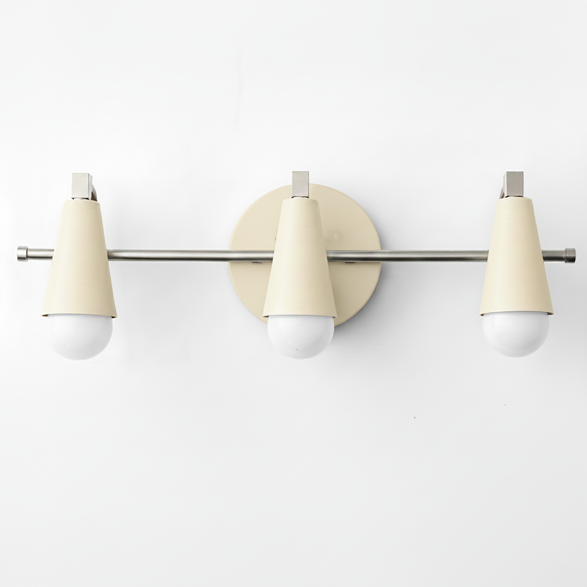 Three-light vanity fixture with matte cream cone shades and polished chrome hardware. - VANITY LIGHT MODEL NO. 8084