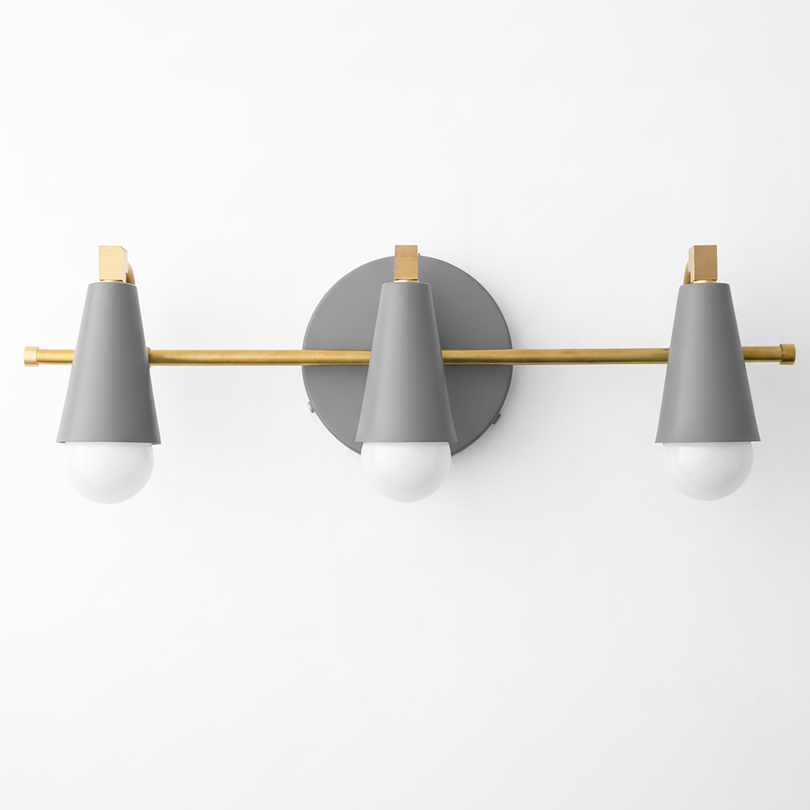 Mid-century modern 3-bulb vanity light with matte gray cone shades and brass accents on a round gray base. - VANITY LIGHT MODEL NO. 8084