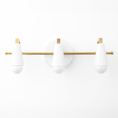 Three white cone-shaped vanity lights with round bulbs mounted on a horizontal brass rod and circular brass wall plate. - VANITY LIGHT MODEL NO. 8084