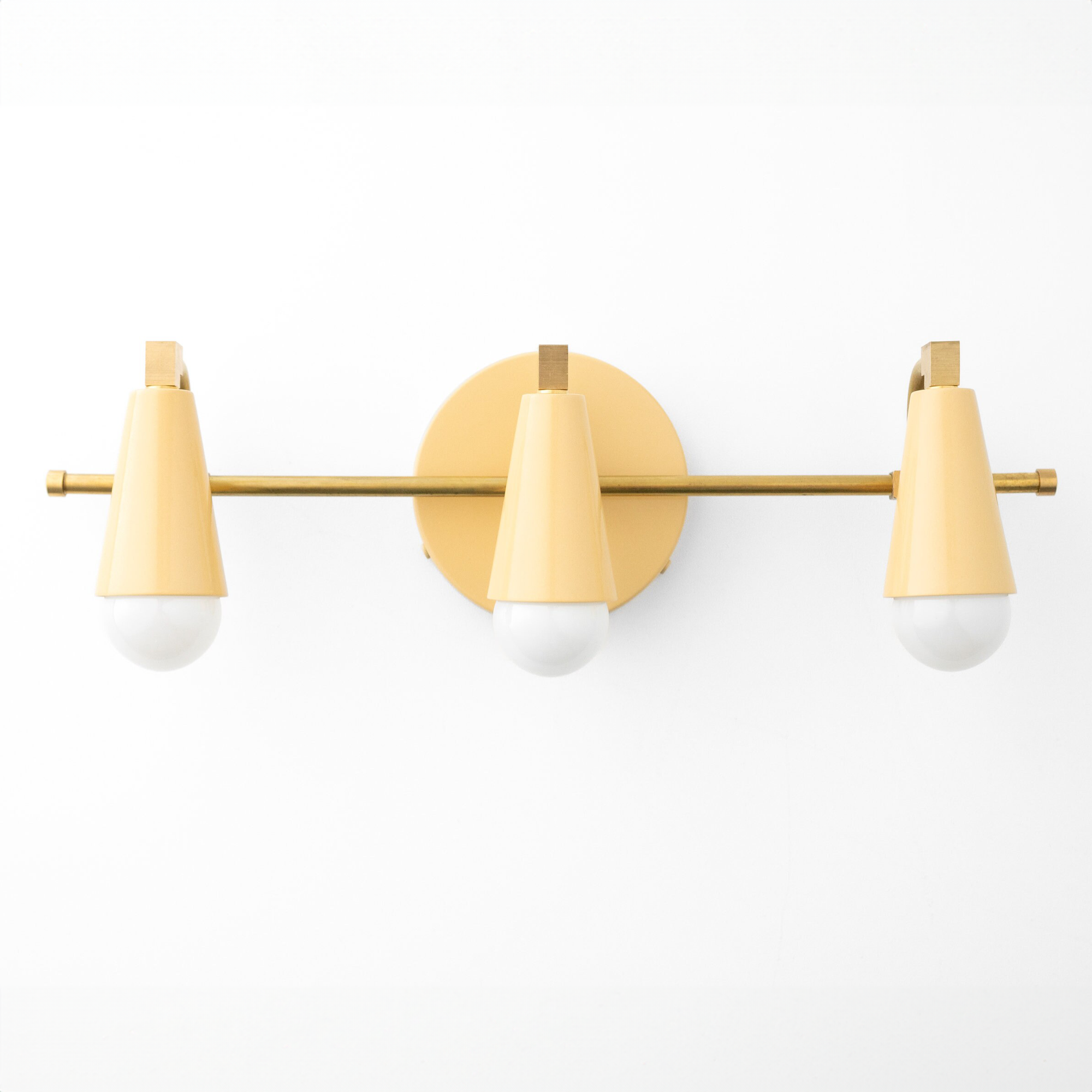 Matte gold three-bulb vanity light with conical shades and a round wall mount. - VANITY LIGHT MODEL NO. 8084