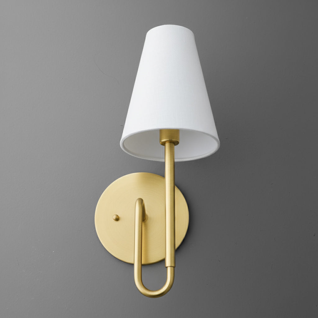 Matte gold metal wall sconce with white tapered fabric shade and single bulb fixture. - SCONCE MODEL NO. 1008