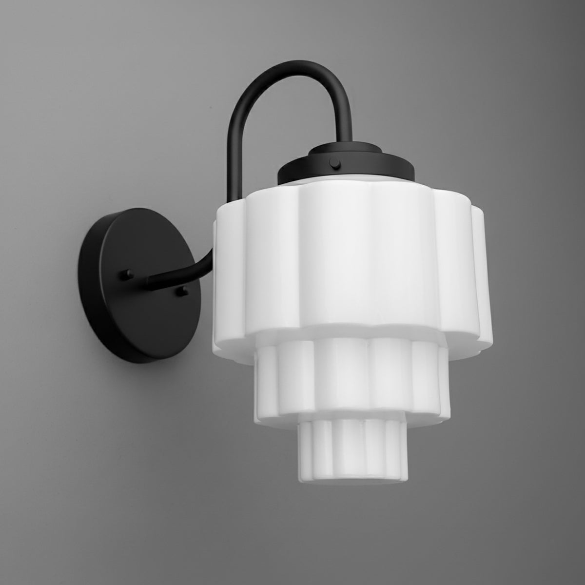Black metal wall sconce with tiered white frosted glass shade in geometric scalloped design. - SCONCE MODEL NO. 1095