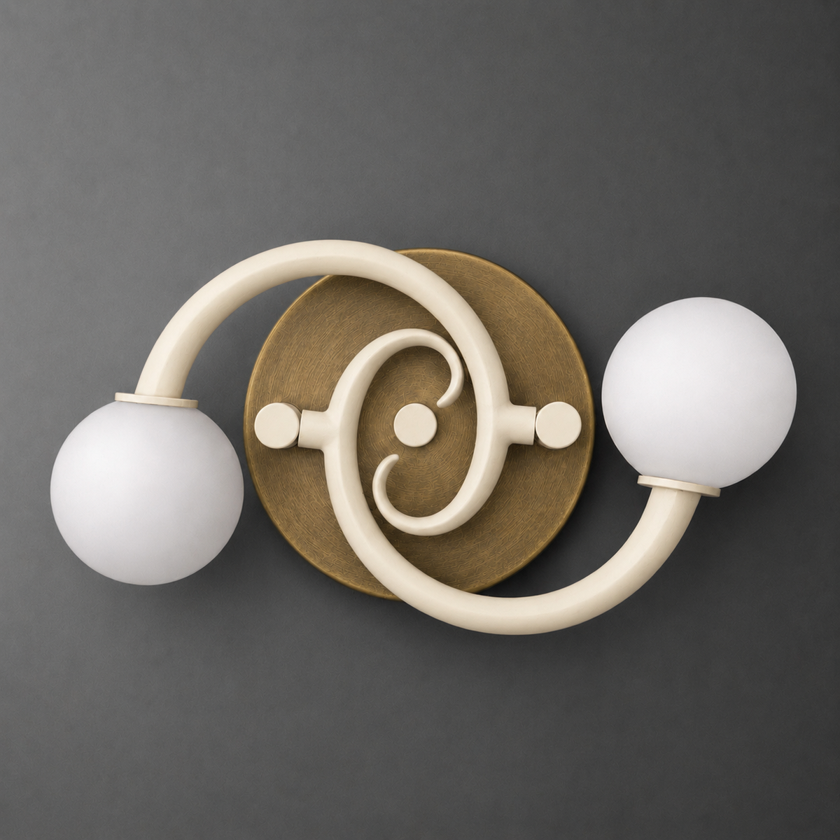 Round brass wall sconce with two curved cream arms holding frosted white globe bulbs. - SCONCE MODEL NO. 9458