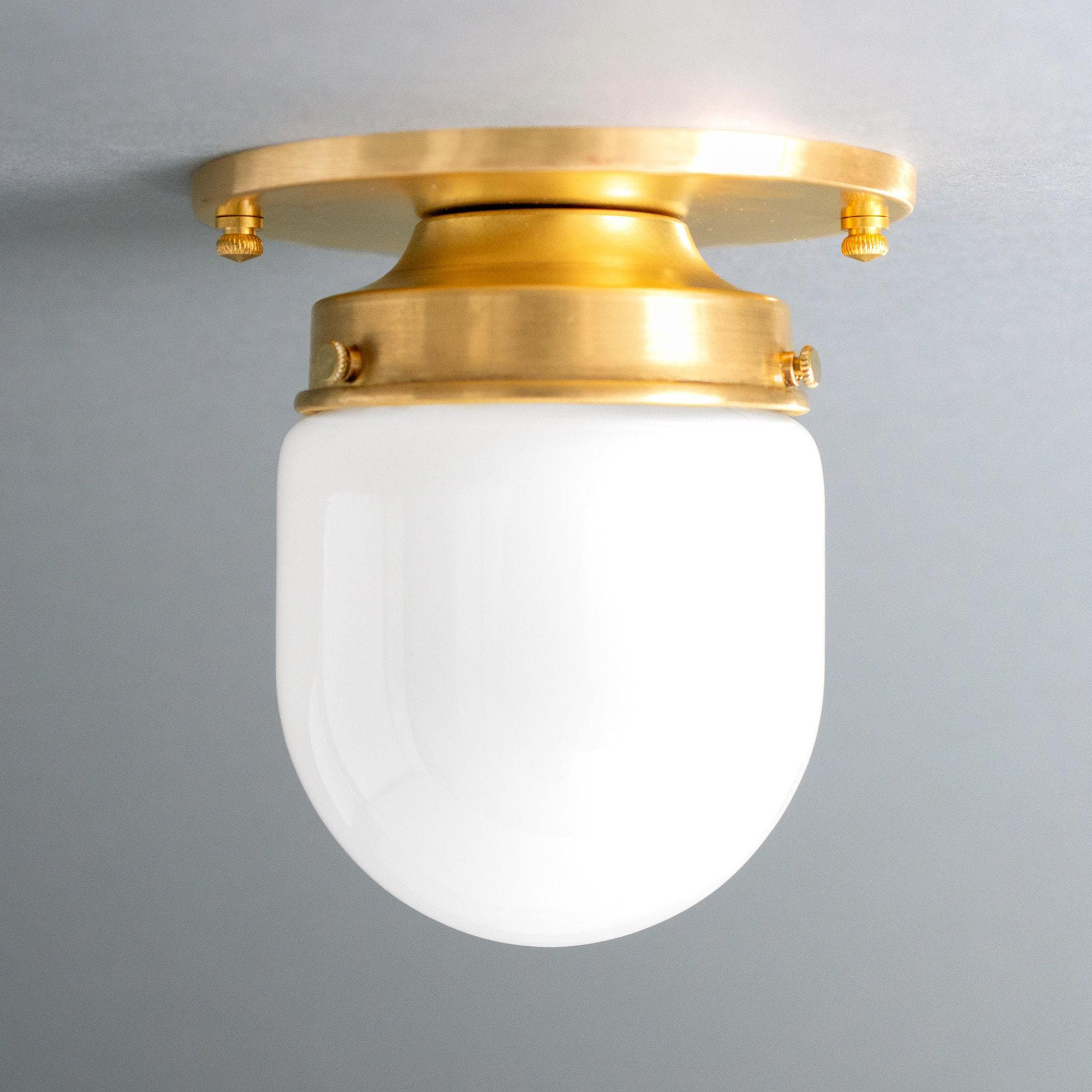 Flush mount ceiling light with polished brass finish and smooth white glass globe shade. - CEILING LIGHT MODEL NO. 9535