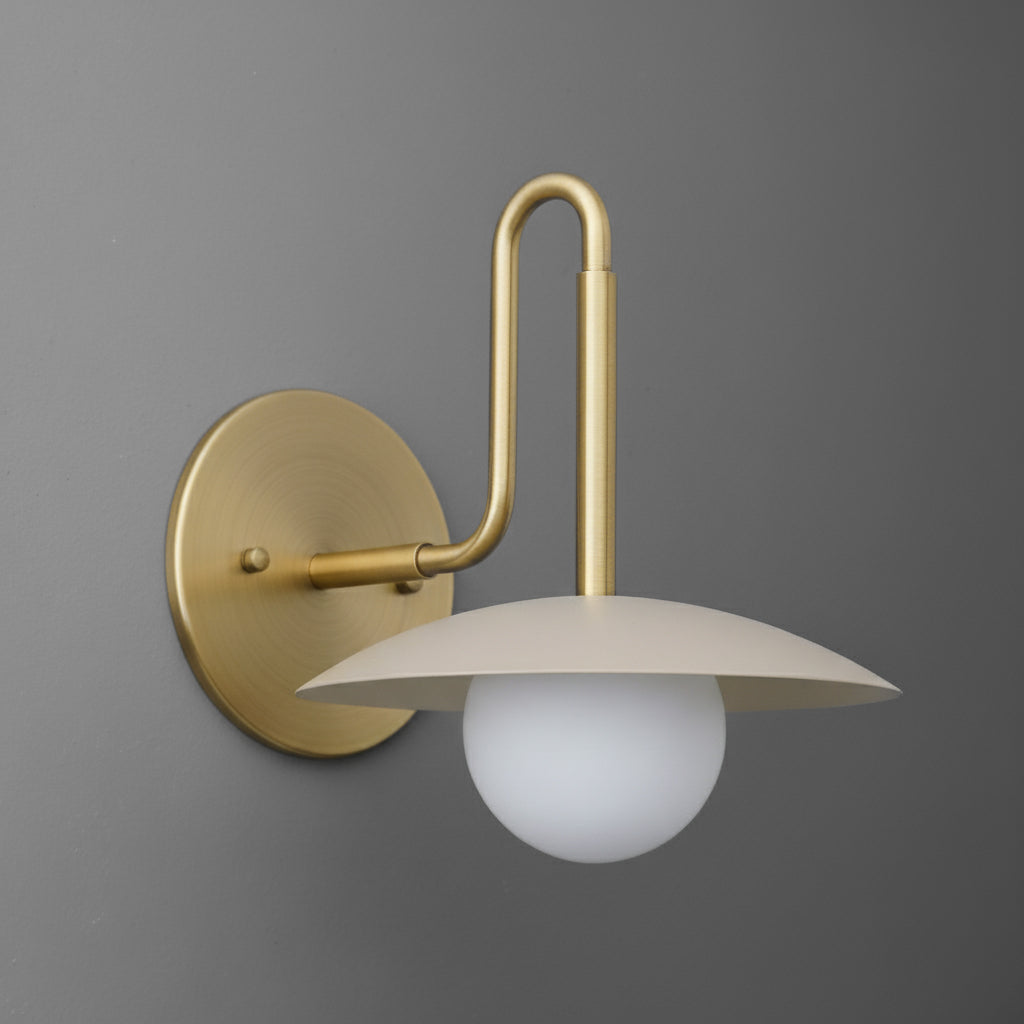 Brushed gold single-bulb wall sconce with curved arm and white frosted glass globe shade. - SCONCE MODEL NO. 1017