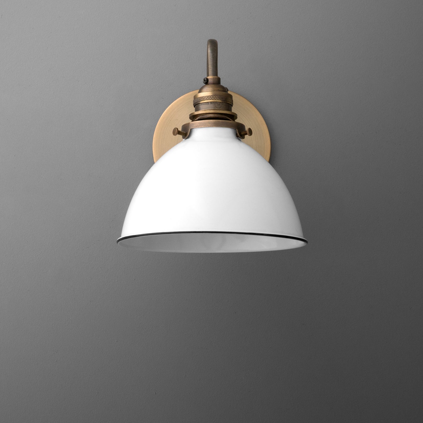 Wall-mounted sconce with white dome shade and antique brass fixture on gray background. - SCONCE MODEL NO. 2587