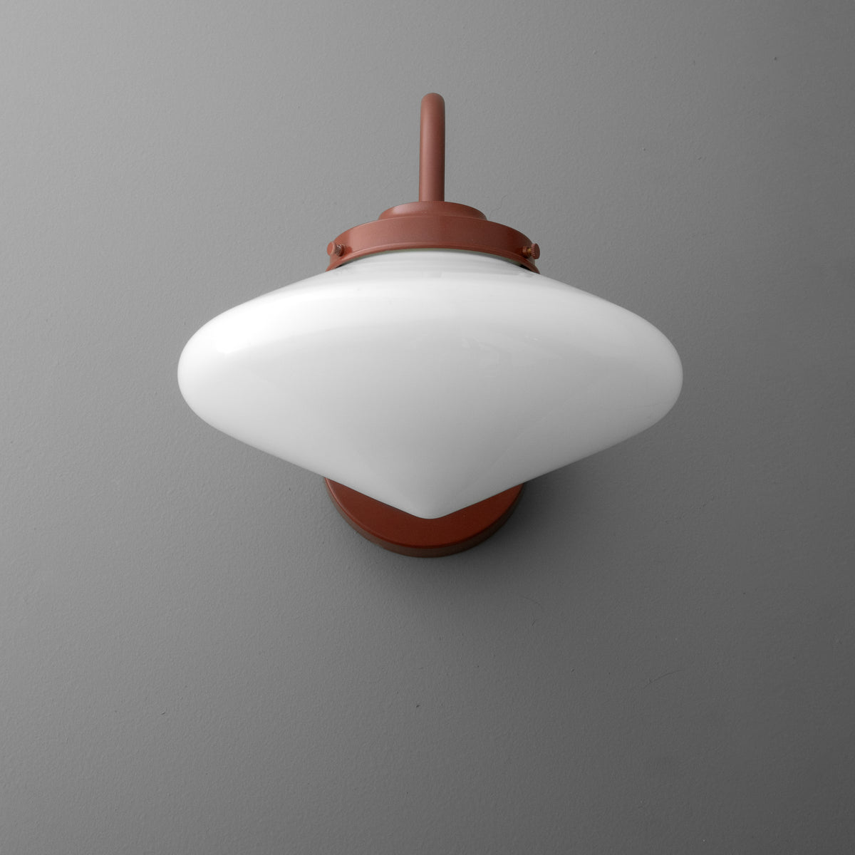 White glass 1-bulb wall sconce with rust-colored metal fixture and curved top design. - SCONCE MODEL NO. 1019