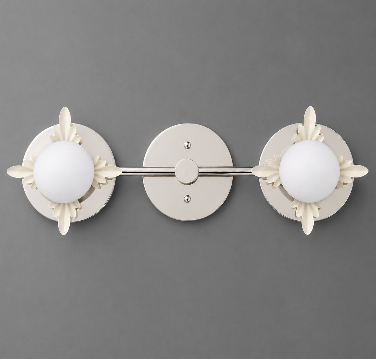 Two-light vanity light in Polished Nickel with Cream leaf accents around opal glass globes on round backplates joined by a straight bar. - VANITY LIGHT MODEL NO. 1118