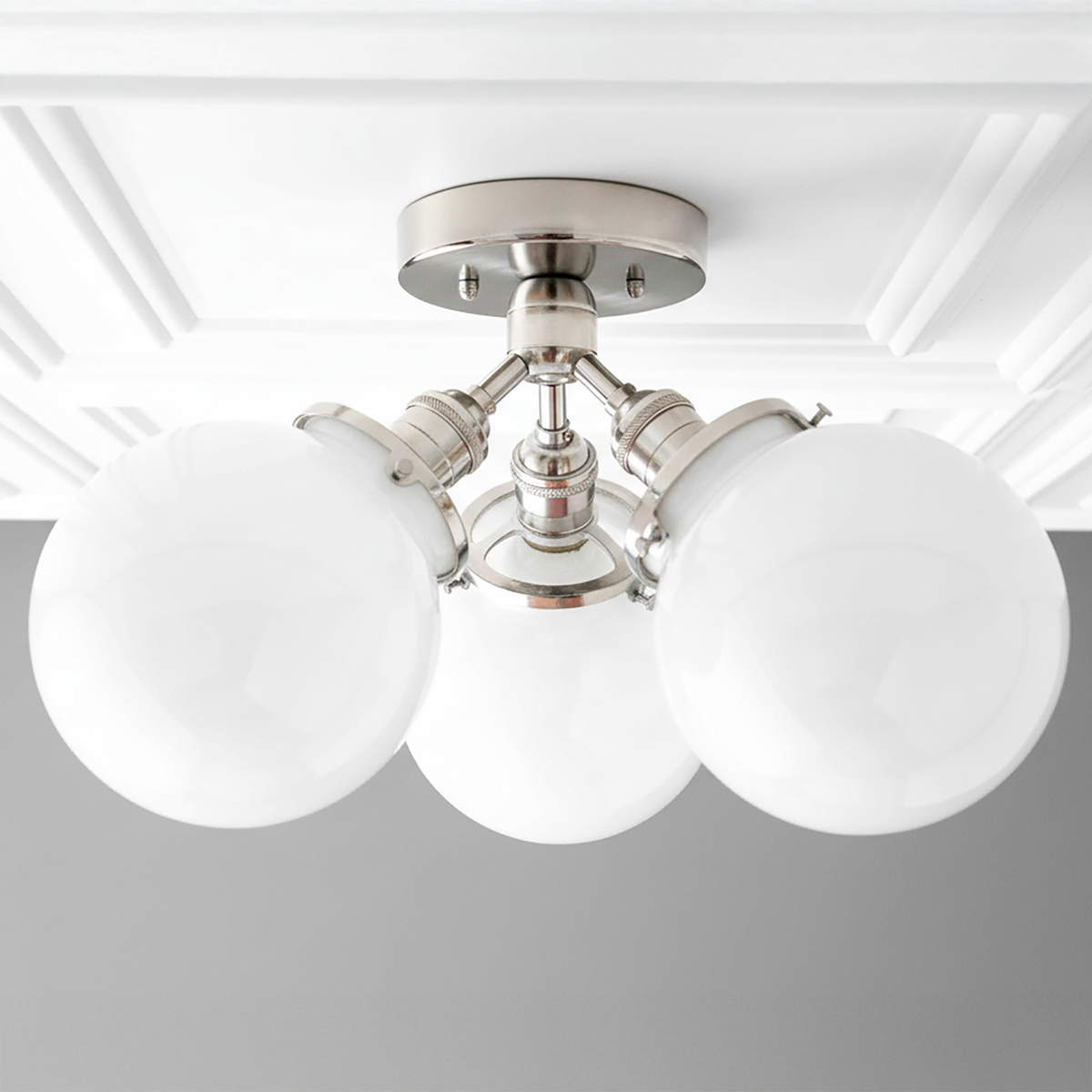 Flush mount ceiling light with three white glass globes and polished nickel finish. - CEILING LIGHT MODEL NO. 0210