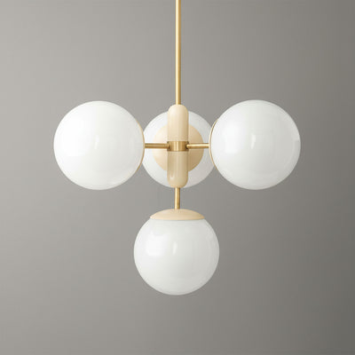 Art Deco chandelier with sealed brass frame and four white glass globes against gray background. - CHANDELIER MODEL NO. 4321