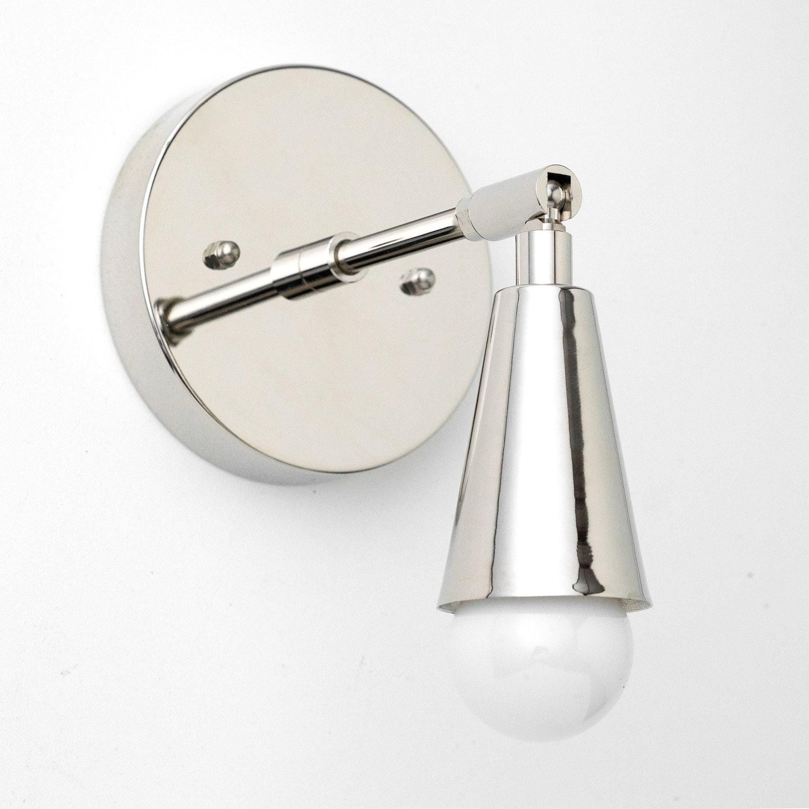 Polished nickel mid-century modern wall sconce with adjustable arm and exposed bulb. - SCONCE MODEL NO. 4339