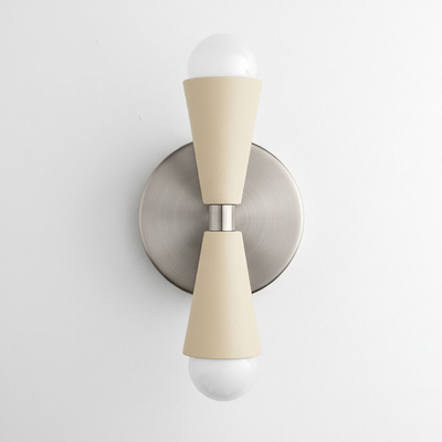 Wall sconce with brushed nickel circular base and cream-colored up/down cone shades holding exposed bulbs. - SCONCE MODEL NO. 4717