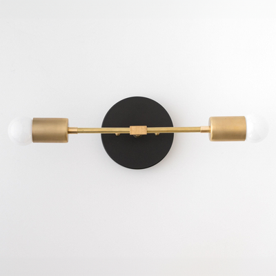 Mid-century modern 2-bulb vanity light with black round base and raw brass cylindrical sockets. - VANITY LIGHT MODEL NO. 5563