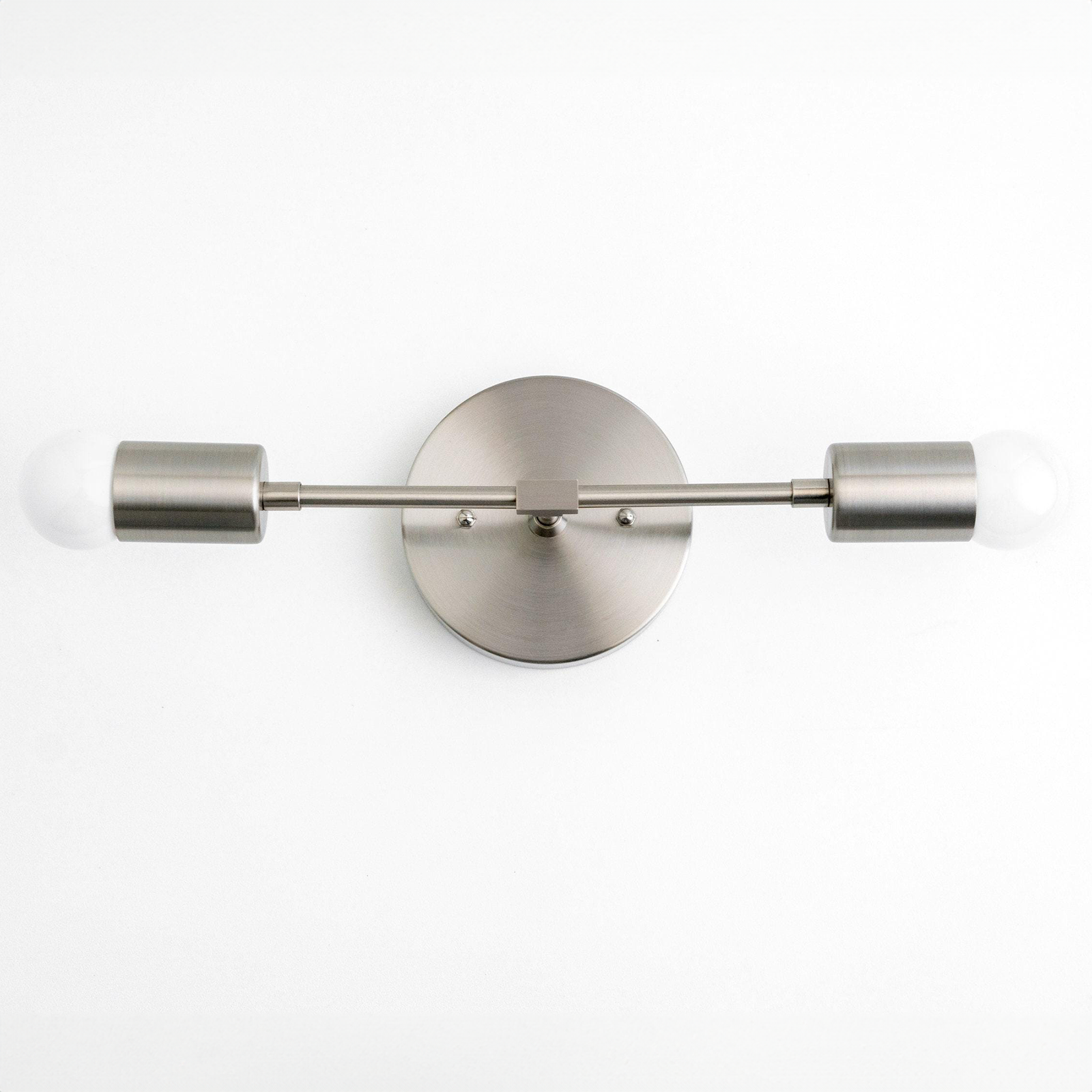 Mid-century modern 2-bulb vanity light in brushed nickel with exposed round bulbs. - VANITY LIGHT MODEL NO. 5563