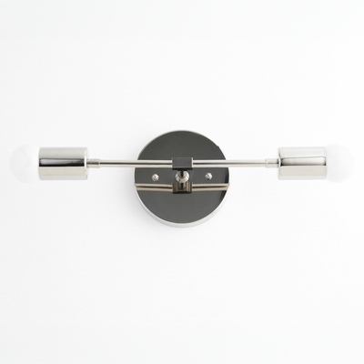 Mid-century modern two-bulb vanity light with black circular base and polished nickel cylindrical shades. - VANITY LIGHT MODEL NO. 5563