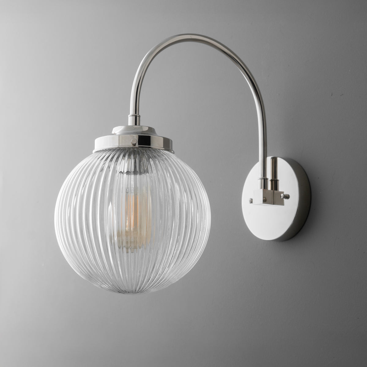 Wall sconce with polished nickel finish and ribbed clear glass globe shade. - SCONCE MODEL NO. 8763