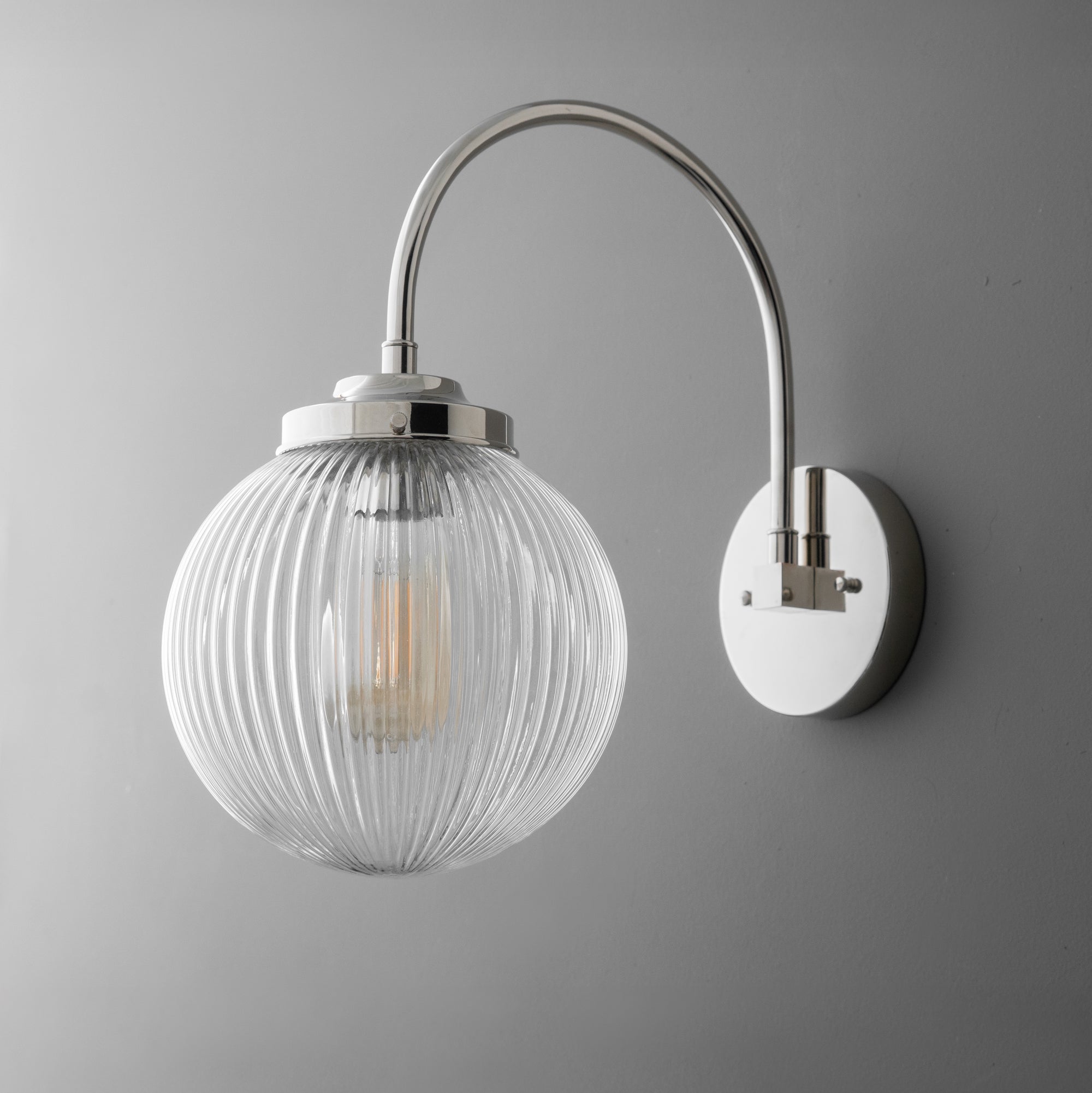 Wall sconce with polished nickel finish and ribbed clear glass globe shade. - SCONCE MODEL NO. 8763