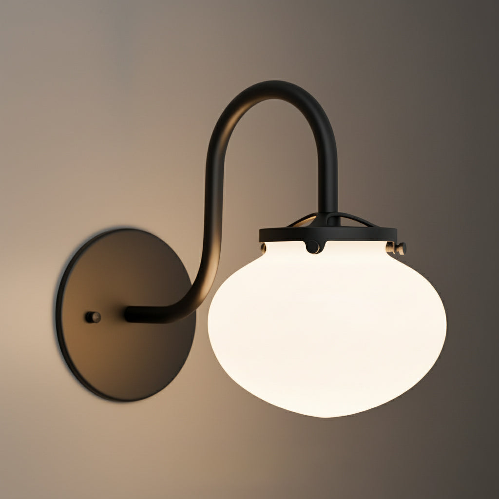 Black metal wall sconce with curved arm and white frosted glass globe shade. - SCONCE MODEL NO. 8563