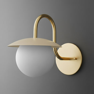 Matte gold metal wall sconce with curved arm, frosted white glass globe shade, and flat disc top shade. - SCONCE MODEL NO. 2206