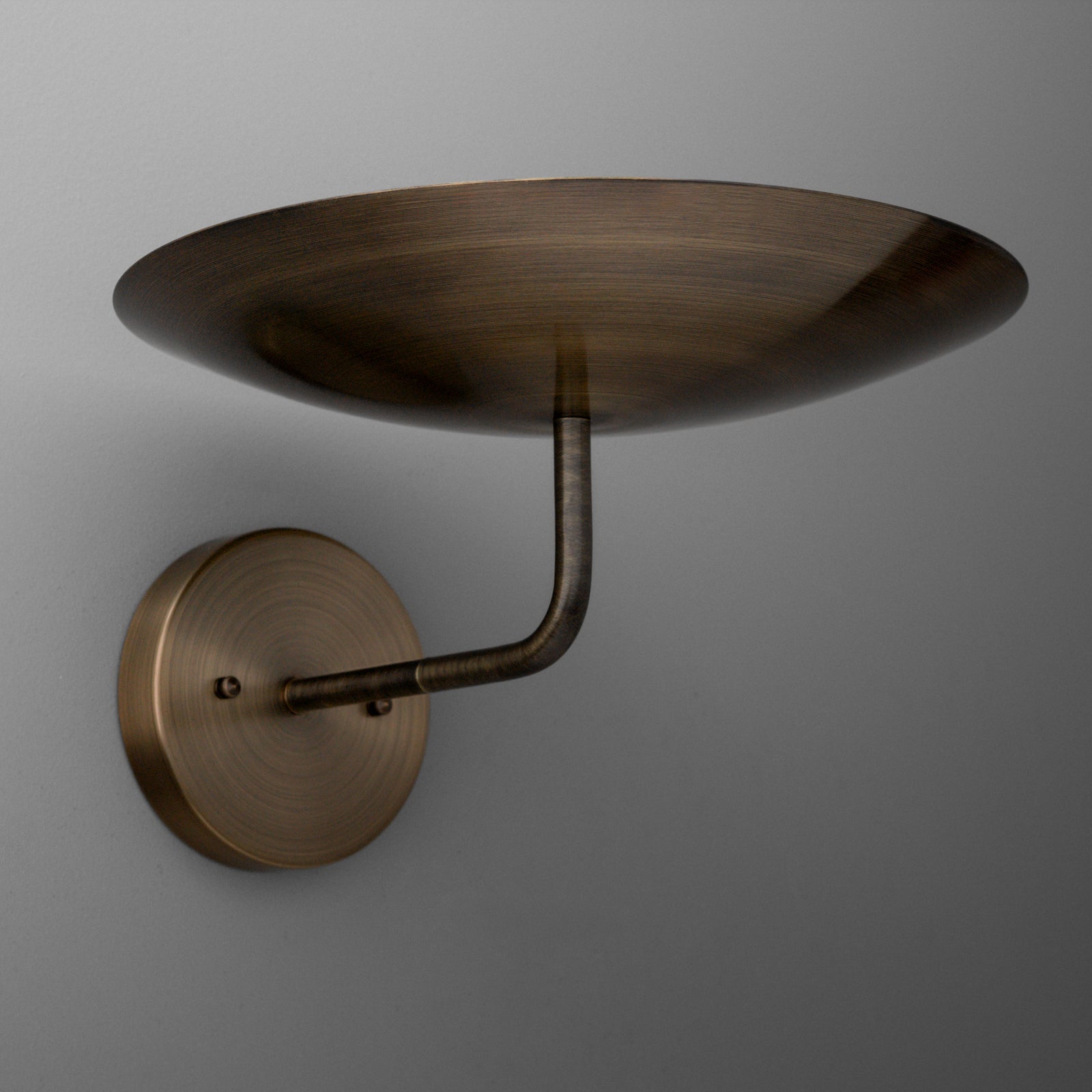 Bronze wall sconce with upward-facing wide, shallow dome shade and single curved arm mounting to round base. - SCONCE MODEL NO. 1504