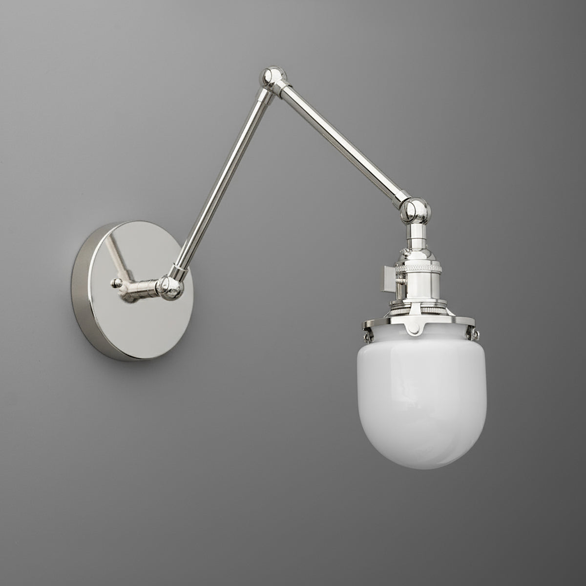 Adjustable metal arm wall sconce with polished chrome finish and white frosted glass globe shade. - SCONCE MODEL NO. 7575