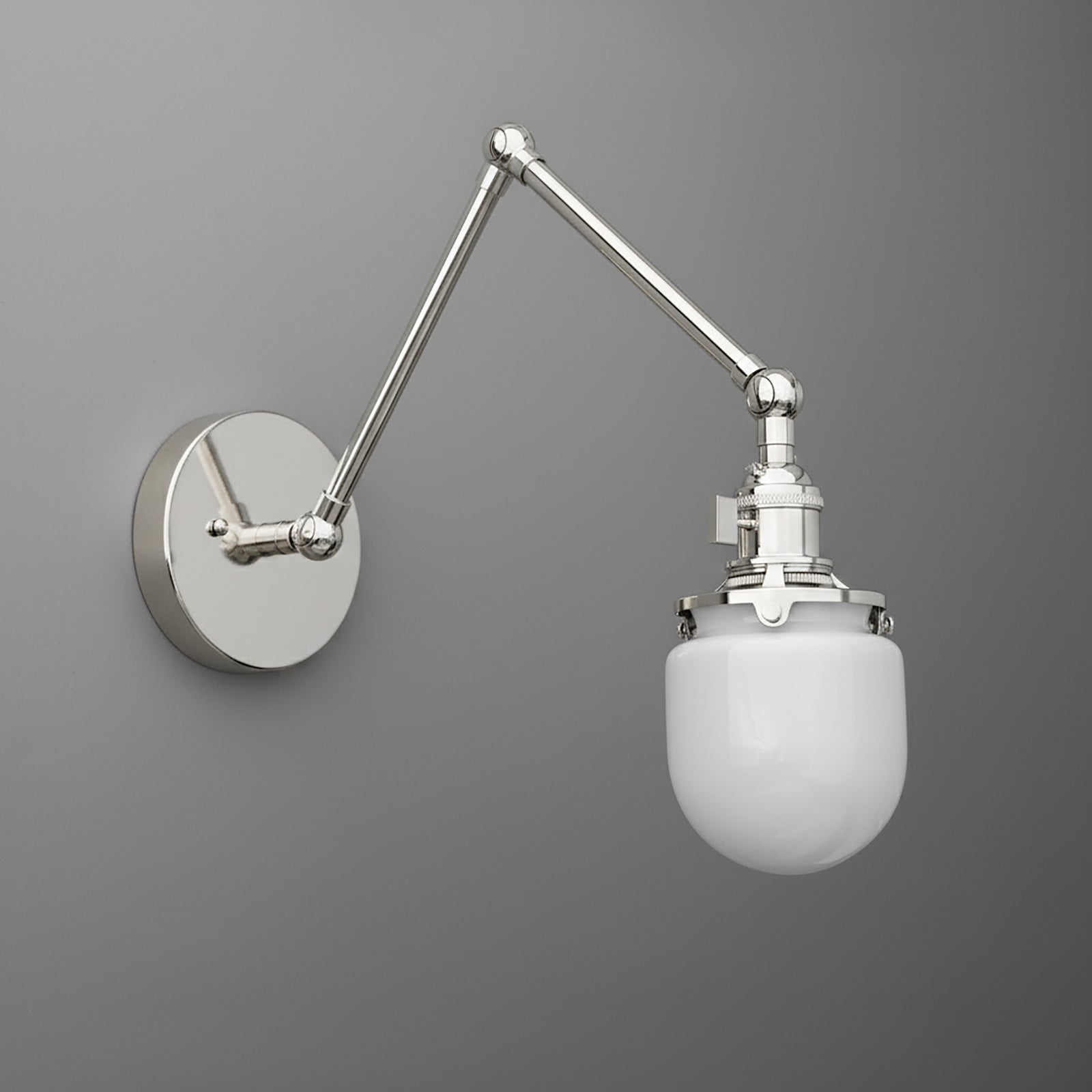 Adjustable metal arm wall sconce with polished chrome finish and white frosted glass globe shade. - SCONCE MODEL NO. 7575