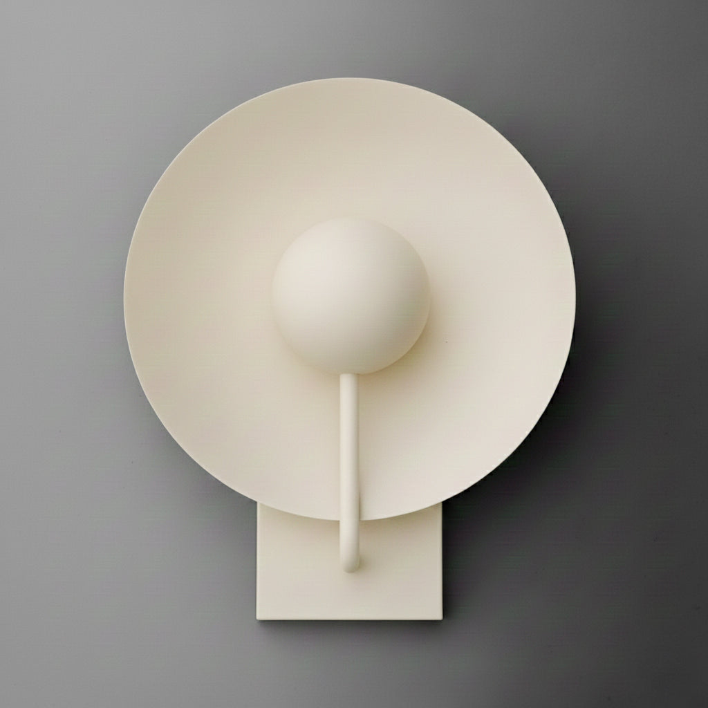 Single-light sconce in Cream with a large round disc shade behind a globe, held on a slim curved stem from a rectangular wall plate. - SCONCE MODEL NO. 9342